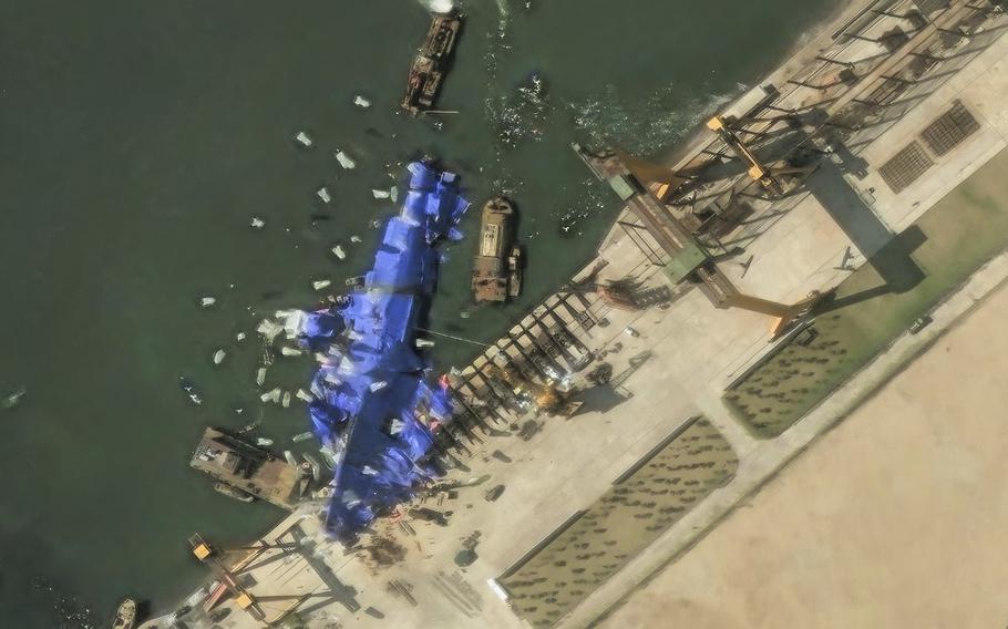A North Korean ship at a pier.