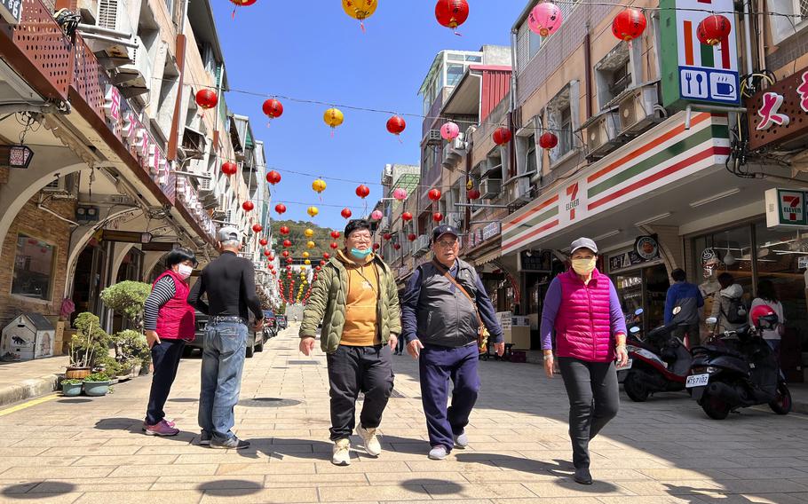 Tourists were seen walking on the street in the shopping district on Nangan, part of Matsu Islands, Taiwan on Tuesday, March 7, 2023. Thousands of residents of Taiwan's outlying islands near the Chinese coast have been without the internet for the past month. Chunghwa Telecom, Taiwan's largest service provider and owner of the two submarines cables that serve Matsu islands, says Chinese vessels cut them. 