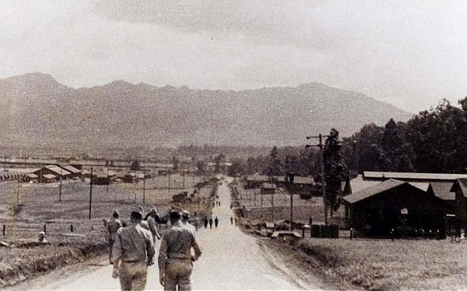 U.S. servicemembers walk in an Okinawan village shortly after the end of the Battle of Okinawa in 1945. Seiei Kiyuna was 12 years old during the World War II battle and hated Americans until U.S. troops changed his opinion.

-30-