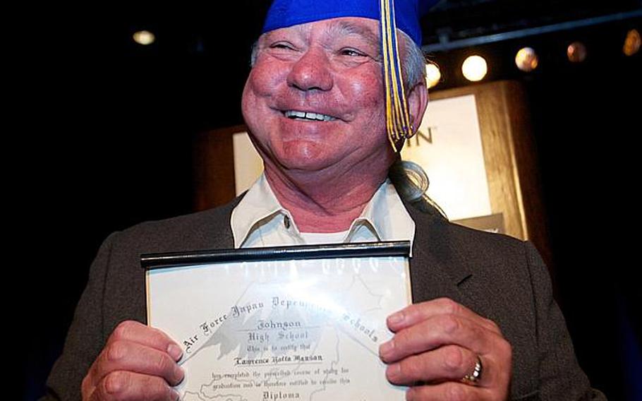 Larry Manson proudly displays the military high school diploma he earned in 1962 but just now received during a special ceremony in Los Angeles Sunday.