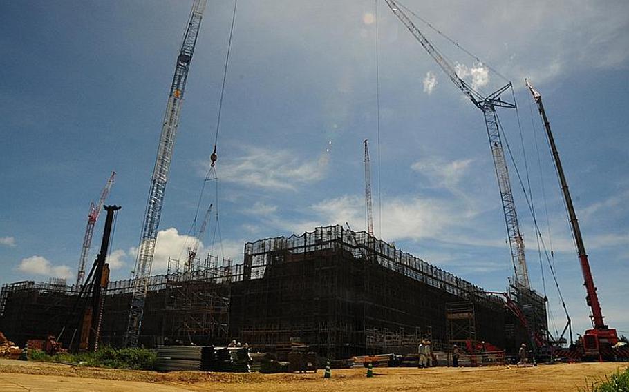 Huge cranes mark the skyline at the construction site of the new Navy hopsital on Camp Foster, Okinawa.  The  443,000 square-foot building will be five stories tall and will replace the existing hospital on Camp Lester.