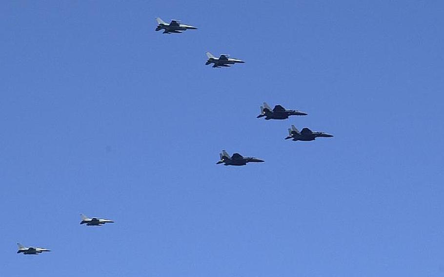 One of four waves of military aircraft pass over the USS George Washington on Monday during the second day of the Invincible Spirit exercise being staged by the U.S. and South Korea in the Sea of Japan.