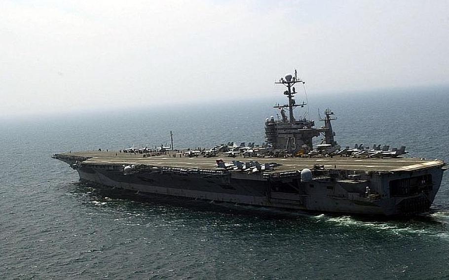The aircraft carrier USS George Washington moves through the Sea of Japan on Tuesday during the third day of the Invincible Spirit exercise the U.S. and South Korea have been staging to send a message of strength to North Korea. The exercise was scheduled to conclude Wednesday.