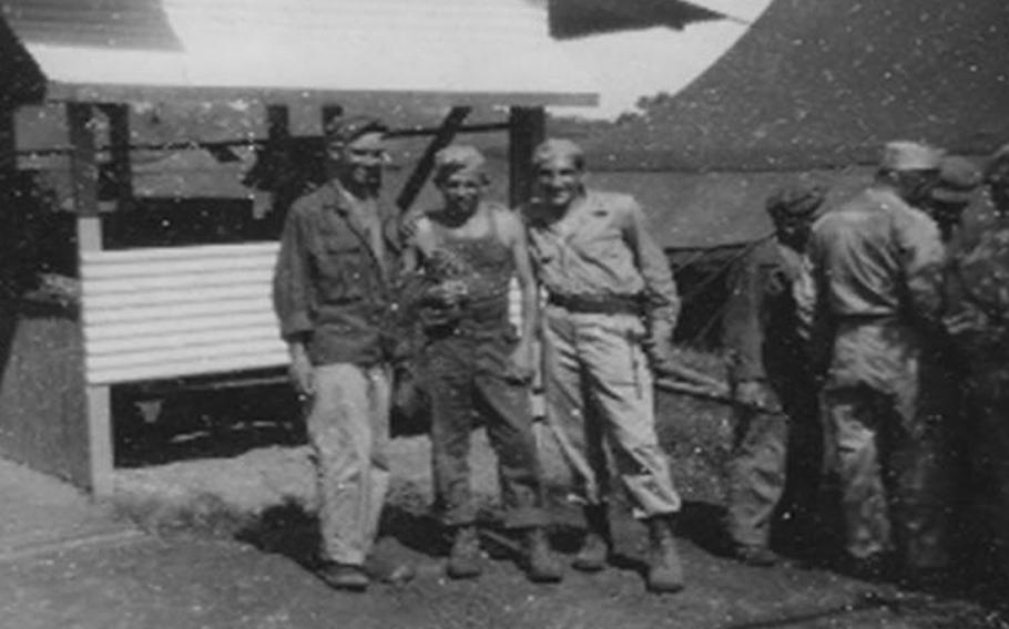 Jim Bashleben, left, Bob Martin, center, and Lester Tenney, all three from Company B, 192nd Tank Battalion, seen here on Sept. 12, 1945, at the Manila Replacement Camp after the war ended. Tenney is one of six World War II POWs returning to Japan next month at the invitation of the Japanese government. The trip is a gesture of goodwill by Japan, which forced some 26,000 U.S. POWs into slave labor during the war.