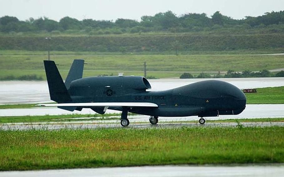 Jeff Schultze/Courtesy of the U.S. Air Force
A Global Hawk unmanned aerial vehicle lands at Andersen Air Force Base in Guam Monday. The drone is the first of its kind deployed to the Pacific and will enable the Air Force to surveille from the Indian Ocean to the coast of South America.