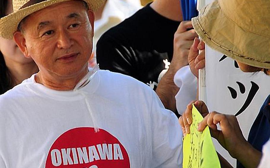 Proclaiming ?Okinawa is Japan? supporters of the U.S.-Japan Secutiry Treaty rally Monday in Naha, the capital of Okinawa Prefecture. Speakers at the rally said U.S. forces on Okinawa are a necessary deterrent to China&#39;s military muscle-flexing in the region.