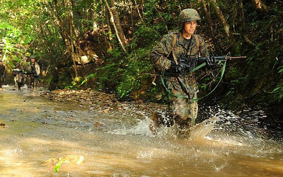 Water is a common element on the endurance course at the Jungle Warfare Training Center at the Northern Training Area on Okinawa. The course takes more than four hours to complete.