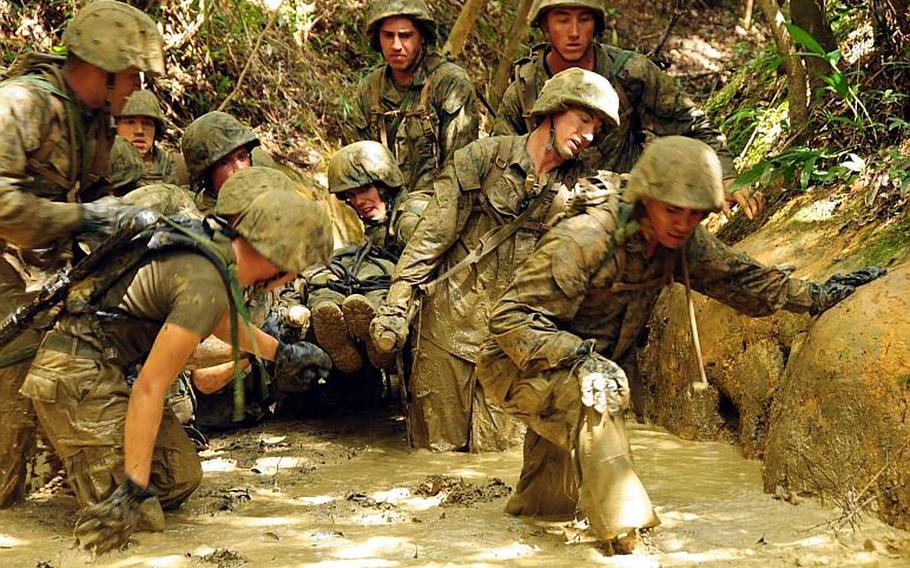 Affectionately called peanut butter, the mud is so thick troops become easily stuck in it. The Marines are not allowed to drop the stretcher carrying a simulated casualty and must push on through the thick mud.