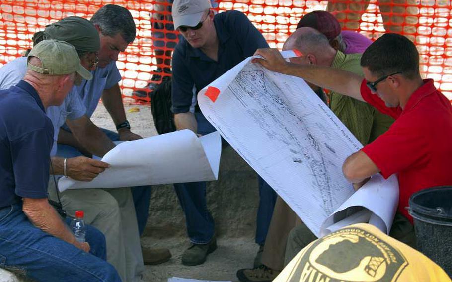 Researchers from the Joint POW/MIA Accounting Command map out one of five sites they excavated at Tarawa during a 45-day mission in August and September to find the remains of troops killed there during November 1943.