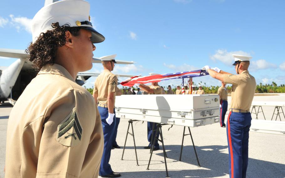 A Marine detail from 2nd Marine Division and Marine Forces Pacific conducts a repatriation ceremony on the island of Tarawa, Republic of Kiribati on Sept. 20. A recovery team from the Joint POW/MIA Accounting Command spent six weeks in August and September searching for the remains of Americans lost during the World War II battle of Tarawa.