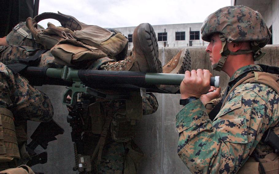 Marines from Company C, 3rd Reconnaissance Battalion carry out the evacuation of a fellow Marine during Military Operations in Urban Terrain training at Camp Fuji, Wednesday.