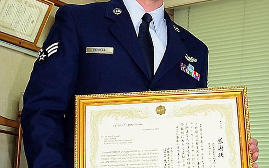 KADENA, Okinawa - Senior Airman Richard Howell, 961st Airborne Air Control Squadron, was presented a Letter of Appreciation Monday for assisting in saving the life of a Japanese elementary school student from drowning. He was presented the letter from Kadena Police Superintendant Tomomitsu Higa.