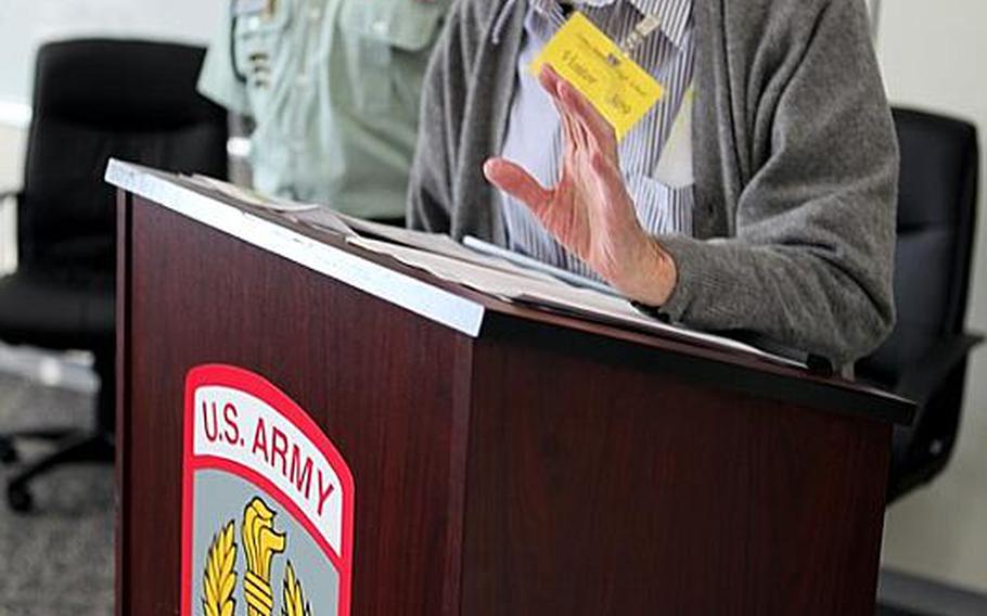 Mike Jurkoic, a retired World War II veteran who once stepped in an elevator with Gen. Douglas MacArthur, shares stories from his Army career with students at Zama American High School on Tuesday.