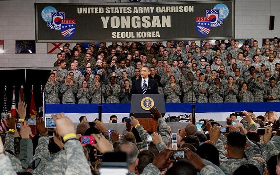 Soldiers use cell phone and digital cameras to record President Barack Obama's speech Nov. 11, 2010, at U.S. Army Garrison-Yongan in Seoul.