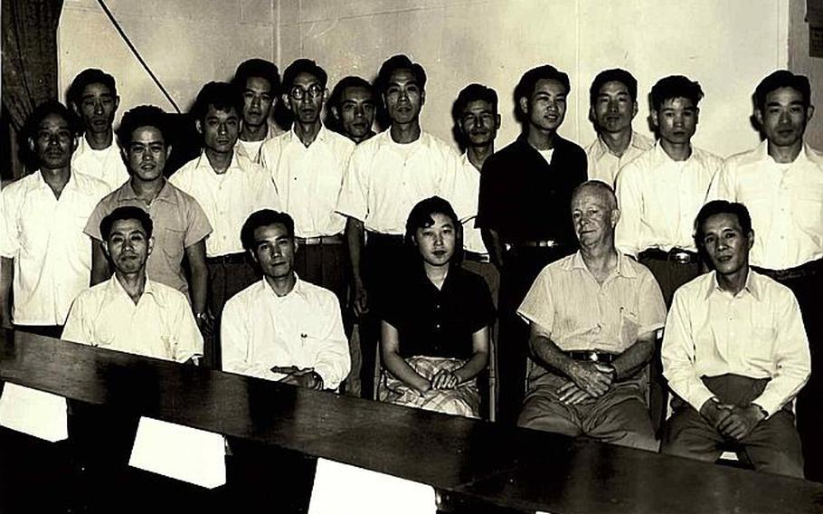Hamaki Tanaka, front row, second from the left, is pictured during his time working at the Civilian Personnel Office at Yokota Air Base, Japan. Tanaka is retiring as the attorney adviser for the Office of the Staff Judge Advocate 5th Air Force after 59 years of service to the U.S. government.