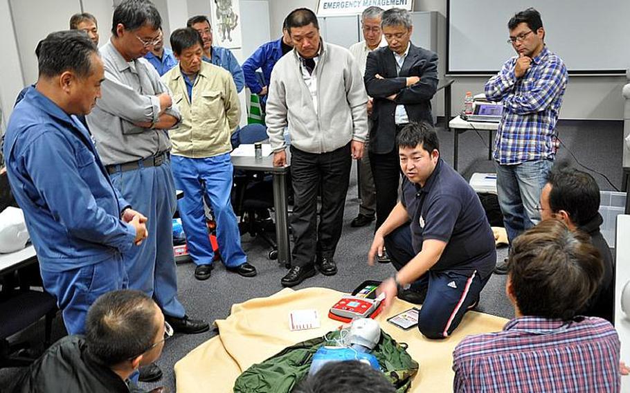 Yasuyuki Yoshikawa, with the Amori Chapter of the Japanese Red Cross Society, gives a training class Tuesday to Japanese employees who work for the U.S. Air Force's 35th Civil Engineer Squadron at Misawa Air Base, Japan.