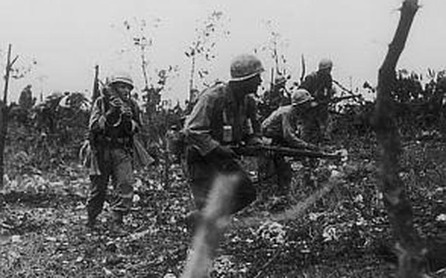 During the final stage of the Battle of Okinawa, the 31st Infantry Regiment engaged a fierce battle in Mount Yoza of Itoman, southern tip of Okinawa's main island. Durel Gibbs is seen with a walkie-talkie. Holding the radio device in the battlefield was a risky role because a long antenna attached to the device would make the holder an easy enemy target, Gibbs explained.