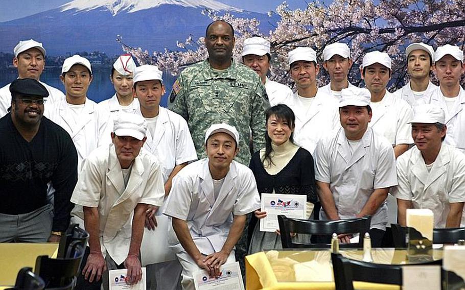 Maj. Gen. Michael T. Harrison Sr., commander of U.S. Army Japan and I-Corps, poses with the Camp Zama Dining facility staff Friday who were recently awarded the Phillip A. Connelly Award as the best small dining facility in the Army.