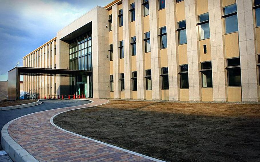 Construction of the Air Defense Command headquarters continues as it nears completion at Yokota Air Base, Japan.