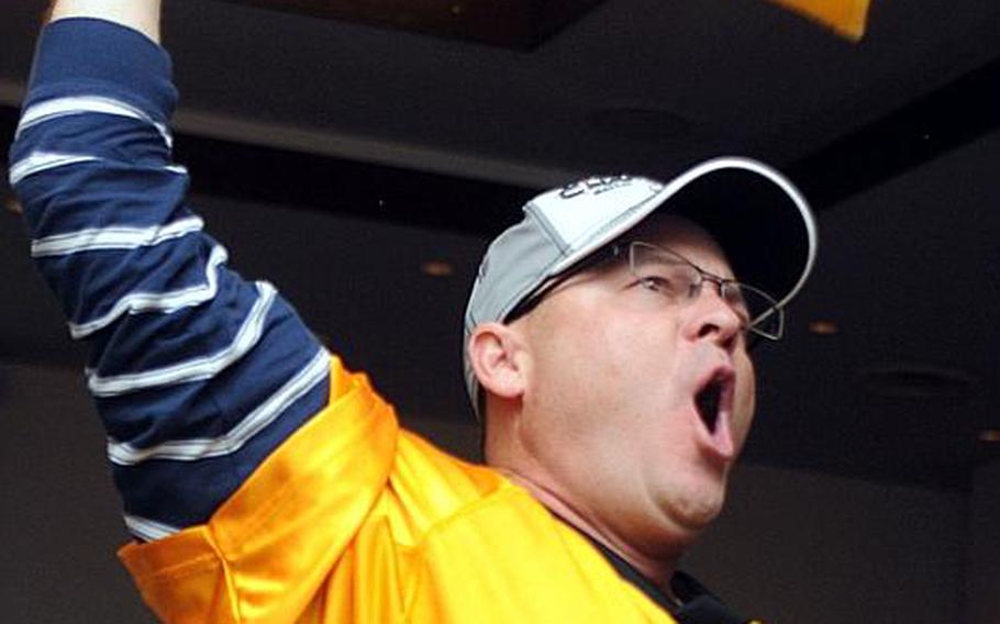Army Lt. Col. Dean Wood waves his Terrible Towel during Monday's Camp Zama Community Club's Super Bowl party.