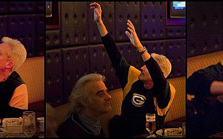 Milwaukee native and lifelong Green Bay Packers fan Peter Macy watches his team score a touchdown in the first half of Superbowl XLV at Tokyo's New Sanno Hotel on Monday.
