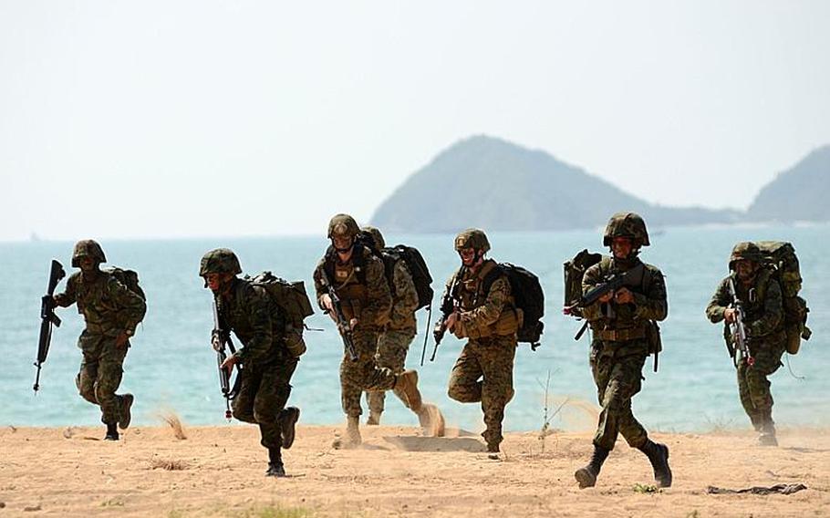Royal Thai Marines, along with infantry Marines with the Battalion Landing Team, 2nd Battalion, 5th Marine Regiment, 31st Marine Expeditionary Unit, 3rd Marine Expeditionary Brigade Forward (FWD) assault the beachhead in a mock amphibious assault raid Thursday during Exercise Cobra Gold 2011. Cobra Gold is a regularly scheduled multinational training exercise designed to improve how the militaries work together.
