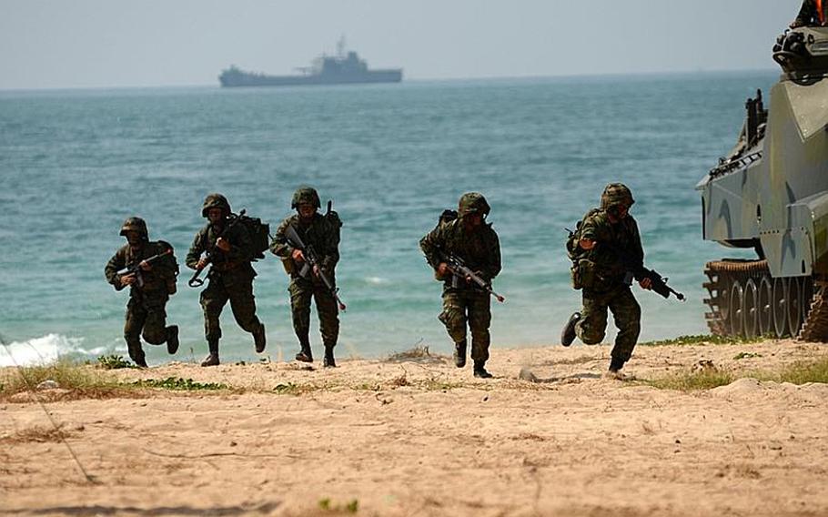 Royal Thai Marines drive an amphibious assault vehicle onto the beachhead in a mock amphibious assault raid in Hat Yao, Thailand, on Thursday during Exercise Cobra Gold 2011. Cobra Gold is a regularly scheduled multinational training exercise designed to improve how partner nation militaries work together.