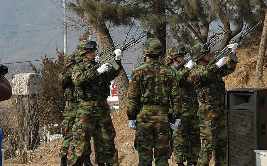 South Korean soldiers fire off a salute during ceremonies Tuesday marking the 60th anniversary of the Korean War's Battle of Chipyong-ni. The event was held at a monument dedicated to the battle in the town now known as Jipyeong-ri.