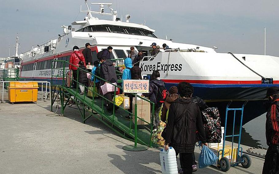 Residents of Yeonpyeong Island board a ferry in Incheon Thursday that will take them home after many have spent almost three months on the South Korean mainland. Most of the island's 1,700 residents were evacuated from the island after North Korea launched a Nov. 23 artillery attack that killed four, injured 18, destroyed 30 homes and damaged scores of others.