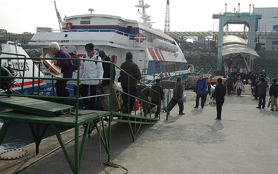 More than 100 Yeonpyeong Island residents board a ferry in Incheon, South Korea, bound for home. The vast majority of Yeonpyeong residents went back home this week, three months after their tiny Yellow Sea island was the target of a North Korean artillery attack.