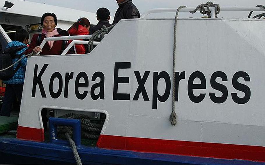 In this file photo, Kim Young-nyeo, then 77, looks out from the deck of a ferry Feb. 17, 2011, that would take her back to her Yeonpyeong Island home in South Korea. Kim has lived on the South Korean mainland since North Korea attacked Yeonpyeong on Nov. 23, 2010.