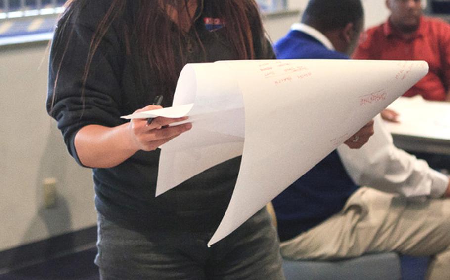 Ruthie Clearwater, a military spouse attending the disaster training course Thursday at Yokota Air Base, Japan, discusses her ideas on how to deal with disasters.