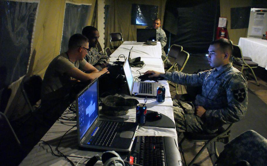 Spc. Timothy Moore, right, Pfc. Spencer Hellewell, front left, and Sgt. Lontray Freeman, second from the left, from the 602nd Air Supply Battalion at Camp Humphreys, prepare for a driving detail for the annual Key Resolve/Foal Eagle exercise Friday at U.S. Army Garrison-Yongsan.