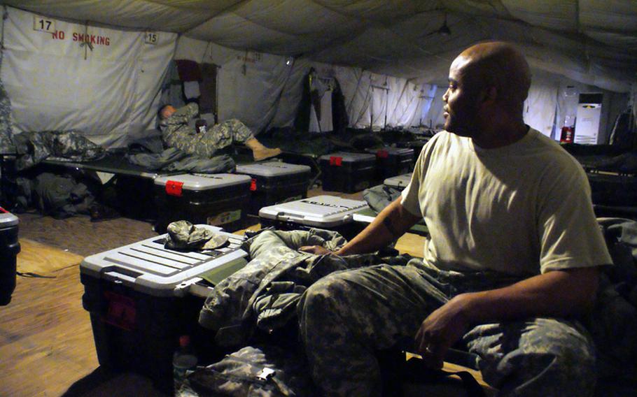 Spc. Nicholas Alexander, right, of the 2nd Battalion, 1st Air Defense Artillery in Camp Carroll, talks to another soldier in their tent at U. S. Army Garrison-Yongsan in Seoul. The tent is one of many for soldiers participating in the annual Key Resolve/Foal Eagle exercise, which begins Monday.