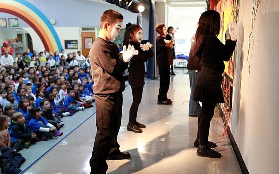 Students perform a mime routine Friday to celebrate African-American history and culture at Yokota West Elementary School in Japan.