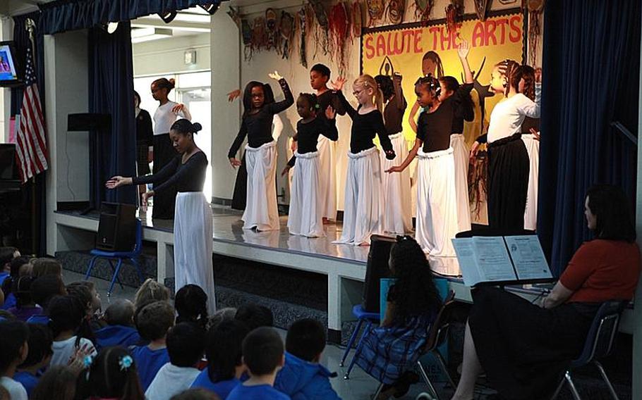 Students perform an interpretive dance routine Friday to celebrate African-American history and culture at Yokota West Elementary School in Japan.