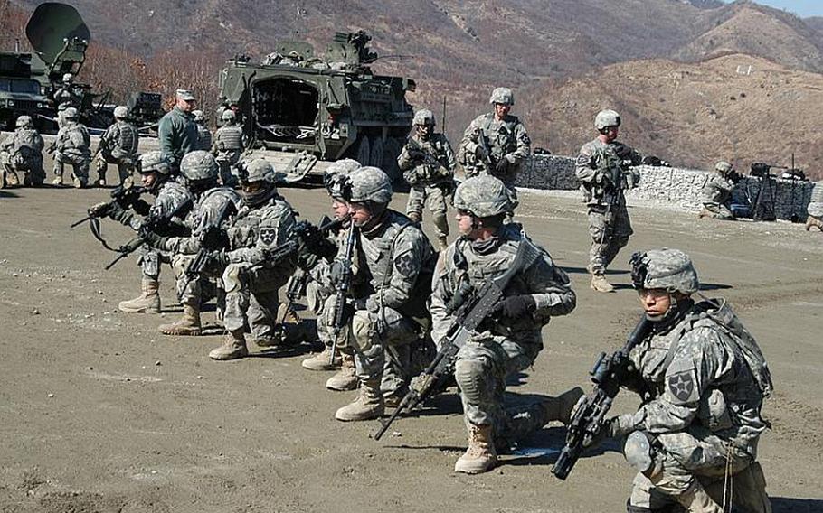 Soldiers line up after exiting four Strykers brought to South Korea for the annual Foal Eagle/Key Resolve live-fire drills near the Demilitarized Zone in March of 2011.