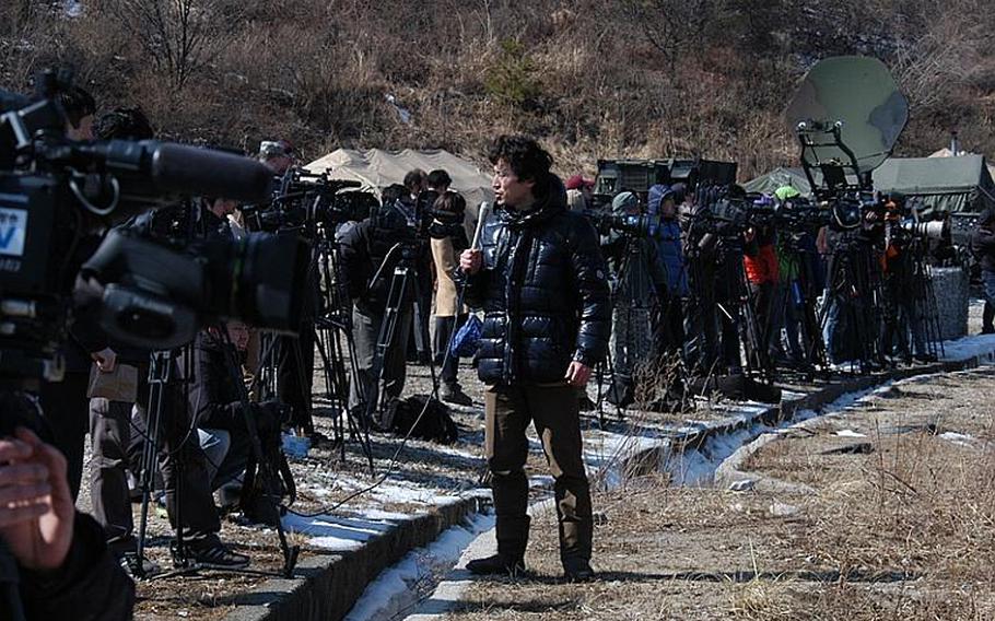 Media representatives take in events Monday as a live-fire exercise was staged by the U.S. military in South Korea, near the Demilitarized Zone. Approximately 100 reporters, photographers and videographers were on hand for the event.