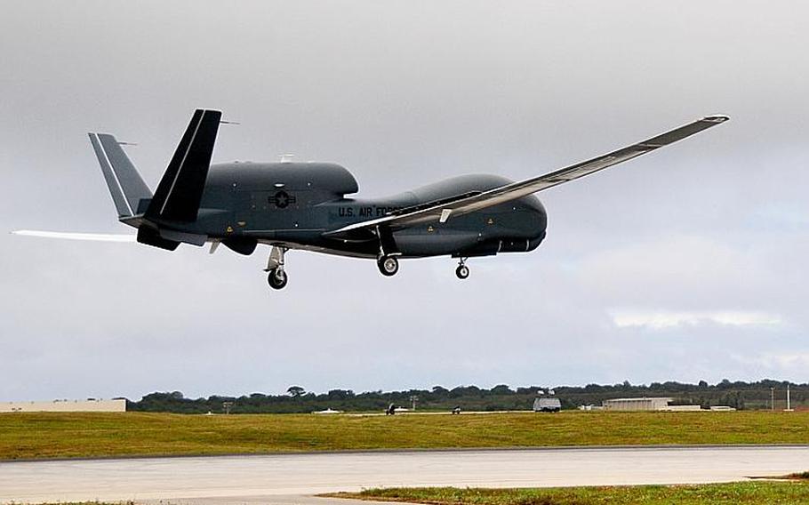 An RQ-4 Global Hawk returns to Andersen Air Force Base in Guam on Friday after collecting images that will be used to help Japanese officials focus their search and recovery efforts following the March 11th earthquake and tsunami.