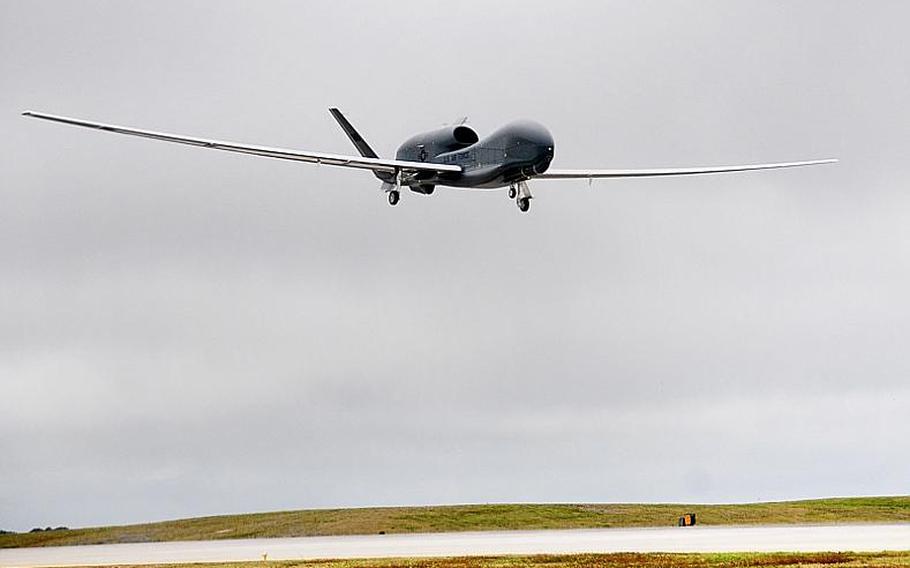 An RQ-4 Global Hawk returns to Andersen Air Force Base in Guam on Friday after collecting images that will be used to help Japanese officials focus their search and recovery efforts following the March 11th earthquake and tsunami.