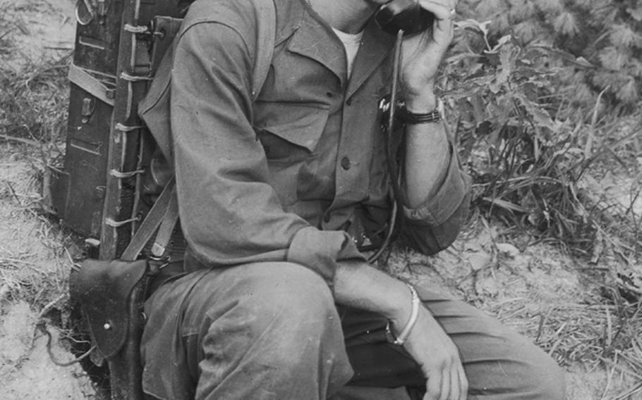 In this photo from 1950, Cpl. John Myrick of Nashville, Tenn., assistant communications chief of courageous Love Company of the 7th Infantry Regiment, 3rd Division, illustrates the use of the Army&#39;s SCR 300 radio during action for which the unit was commended by Supreme Allied Commander Gen. Matthew R. Ridgway.
