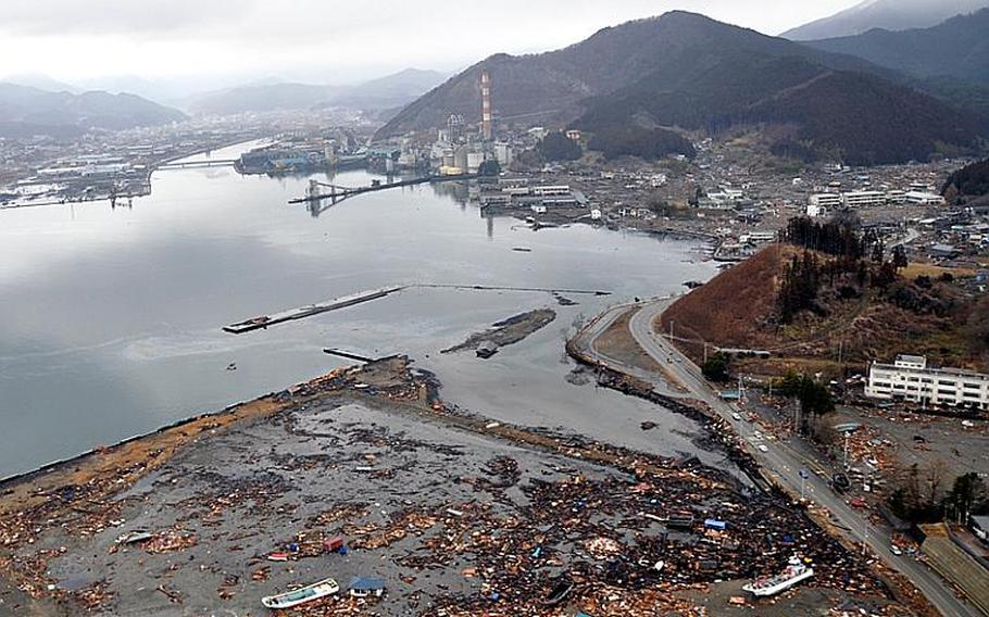 U.S. Navy helicopters, including those belonging to Helicopter Anti-Submarine Squadron 14,  crisscross the coastal area of northeastern Japan Tuesday delivering humanitarian relief supplies to Japanese communities like this one that was mostly destroyed by a March 11 earthquake and tsunami.