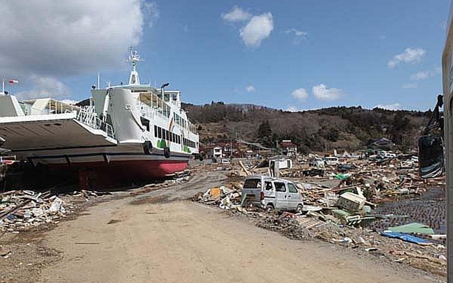 The March 11 earthquake and tsunami left plenty of damage on Oshima Island. U.S. and Japanese personnel and equipment were brought together Sunday to deliver relief supplies and restore power to the island, off the eastern coast of Honshu.