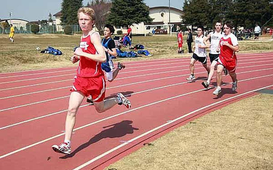 Robert Beard, a student a Nile C. Kinnick leads the way during the 3,000-meter run Saturday at Bonk Field at Yokota Air Base, Japan. The young athletes came from schools throughout the Kanto region to participate in Sports Day on the base.