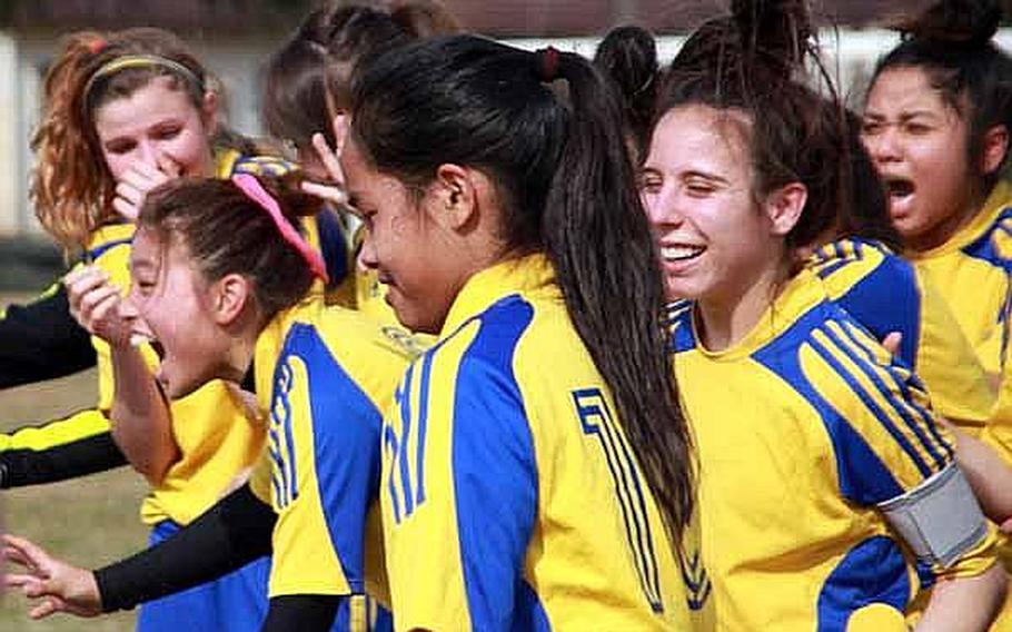 Girls from Yokota High School get psyched up for their soccer match at Sports Day on Saturday at Bonk Field, at Yokota Air Base, Japan. The young athletes came from schools throughout the Kanto region to participate in the sports day. The regularly scheduled sporting events for Defense Department schools' athletes in the Kanto Plain were canceled following the March 11 earthquake, leading officials to come up with the sports day as a way for the athletes to take part in some competition.