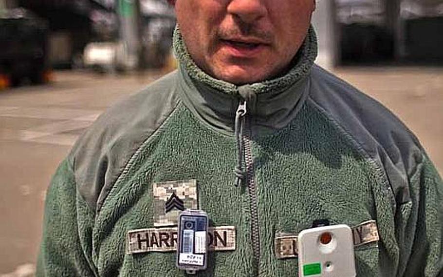 Sgt. James Harrison, 31, with the 35th Combat Sustainment Support Battalion, talks about the two dosimeters the Army and Air Force require him to wear at the temporary U.S. military camp set up at Sendai Airport in Sendai, Japan.