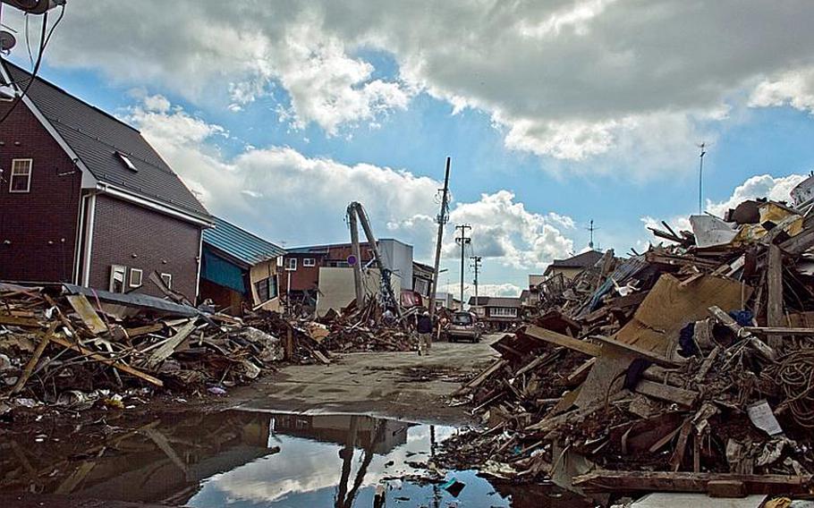 Standing water remains Monday in areas damage by the March 11 tsunami in Ishinomaki, Japan.