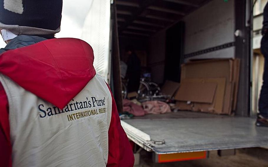 The back of a truck sits mostly empty after Marines from Okinawa and Camp Fuji assisted in the delivery of aid provided by the Christian relief organization Samaritan's Purse to the displaced residents of the Watanoha Elementary School shelter in Ishinomaki, Japan. The U.S. military has been coordinating with other NGOs to deliver aid, officials said.