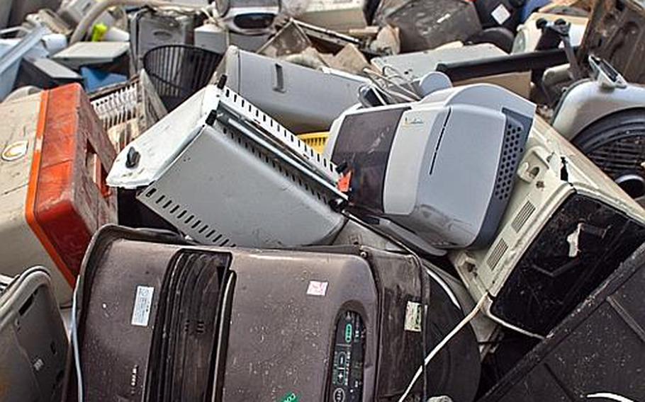 A pile of thousands of destroyed electrical appliances sit at one of two tsunami-related trash dump sites in Ishinomaki, Japan.