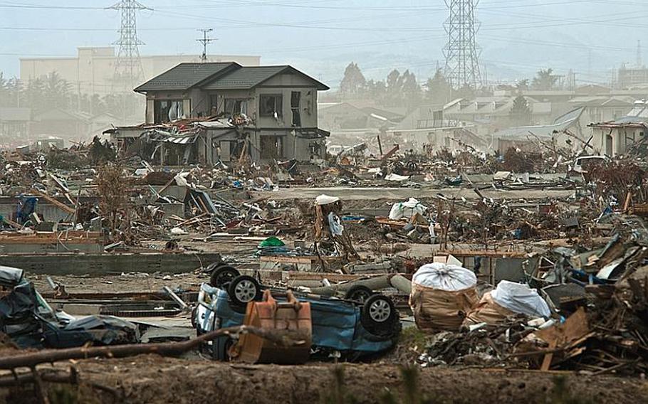 More wreckage waits to be cleared at the tsunami devestaed Nagahama Beach area of Sendai.